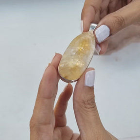 Enormous oval shaped raw citrine stone pendant