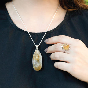 Enormous oval shaped raw citrine stone pendant